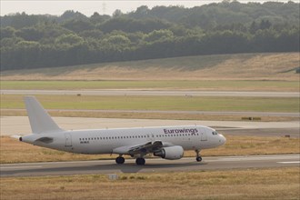 Passenger aircraft Airbus A320-214 of the airline Eurowings on the tarmac at Hamburg Airport