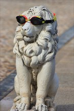Lion statue with diving goggles