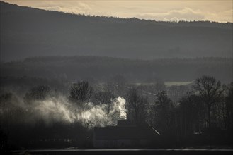 A chimney smokes in Nieder Seifersdorf