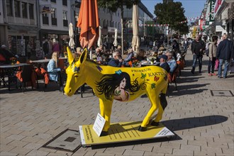 Donkey as symbol of the city and advertising medium in the pedestrian zone in the city centre