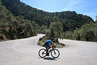 Road cyclist on the Coll de Soller in the Tramuntana Mountains