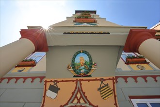 Facade with painting and ornaments of the town hall in backlight