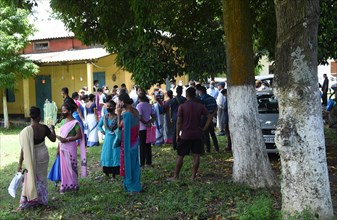 Beneficiaries waiting to receive COVID-19 coronavirus vaccine dose during a vaccination campaign on the outskirt of Guwahati in India on Monday