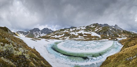 Half-frozen mountain lake