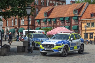 Police cars on the square in the old town of Ystad