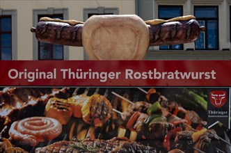 Market stall advertising Thueringer Rostbratwurst