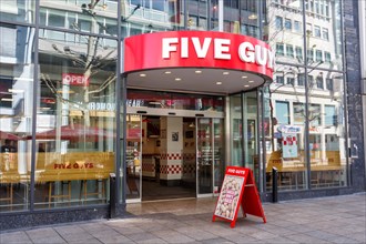 Five Guys brand fast food hamburger restaurant with logo on Koenigstrasse in Stuttgart