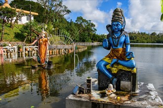 Right Sculpture Figure Statue of Hindu God Hindu Deity Shiva of Hindu Religion Left Woman Wife of Shiva Parvati in Lake Sacred Hindu Lake Ganga Talao