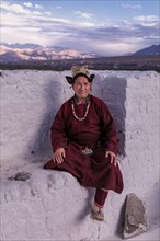 Elderly man in traditional Ladakhi clothes