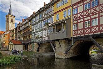 Half-timbered houses of the Kraemerbruecke with the river Gera and the Aegidienkirche