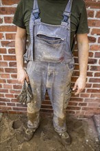 Dirty and tattered dungarees of a construction worker. Berlin