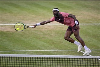 Frances Tiafoe USA converts his match point to win the title