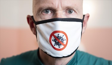 Man with mask depicting the Corona virus