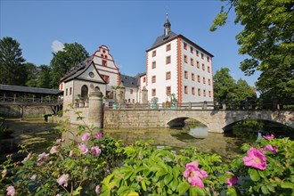 Baroque Kochberg Castle with pond and arched bridge