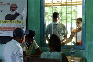 People registering to get COVID-19 coronavirus vaccine at a vaccination centre at Chandrapur in Kamrup district of Assam in India on Monday