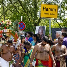 Hindus on the main festival day at the big parade Theer in front of the town sign of Hamm Uentrop