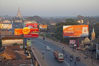 Traffic in street with billboards in the city Bago