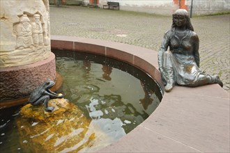 Fairytale fountain with sculptures Frog Prince in the water and Princess