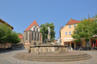Hop fountain with knight figure and Bach church