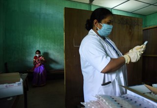 Health worker administers a COVID-19 coronavirus vaccine during a vaccination drive in Guwahati