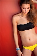 Young woman wearing a colorful bikini