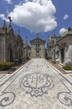 Artistic stone pavement calcada portugesa in the section of the religious order Ordem da Trindade