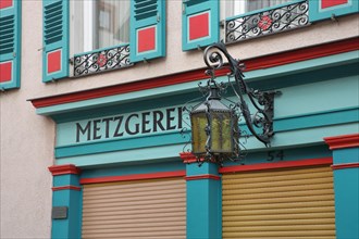 Street lamp and inscription Metzgerei am Fachwerkhaus