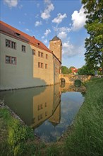 Moated castle built 12th century with tower