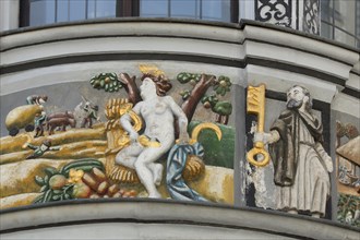 Painting and relief on the oriel of the pharmacy