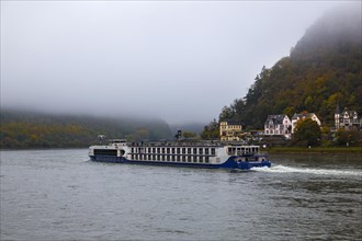 River cruise ship in fog in St. Goar at the Loreley