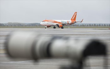 An EasyJet aircraft with the inscription Berlin taxis across the tarmac at BER Airport. Schoenefeld
