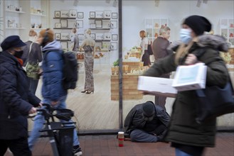 Poverty in Germany. Beggars on the shopping street in Hamburg Altona