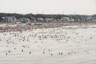 Crowds on the beach and in the sea