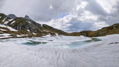 Half-frozen mountain lake