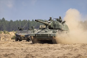 A self-propelled howitzer 2000 and a Fennek armoured personnel carrier during the GRIFFIN STORM exercise in Pabrade. Pabrade