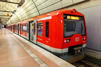 S-Bahn train of the class 474 of Deutsche Bahn at the stop Flughafen Airport in Hamburg