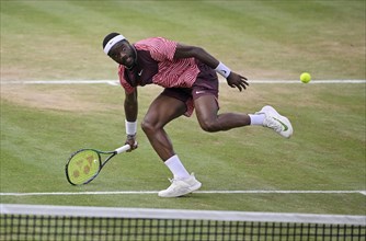 Frances Tiafoe USA converts his match point to win the title