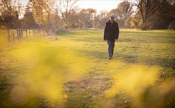 Man goes for an autumn walk alone