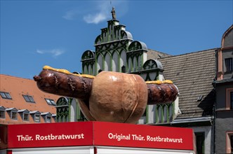 Market stall advertising Thueringer Rostbratwurst