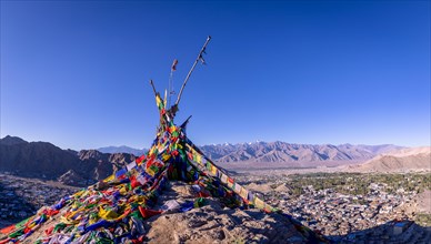 Buddhist prayer flags with Leh in the background