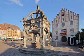 Renaissance market fountain and Gothic town hall built 1529