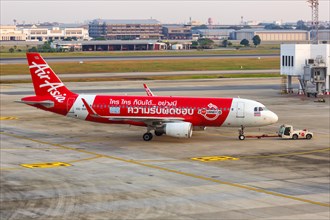 A Thai AirAsia Airbus A320 aircraft with registration HS-BBH and the Now Everyone Can Fly Responsibly special livery at Bangkok Don Mueang Airport
