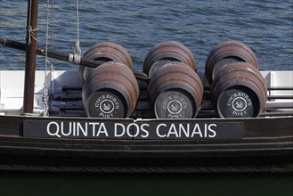 Port wine barrels Cockburns Quinta dos Canais on a historic boat on the river Douro Vila Nova de Gaia