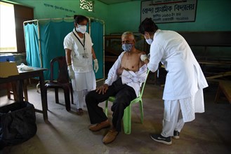 Health worker administers a COVID-19 coronavirus vaccine during a vaccination drive in Guwahati