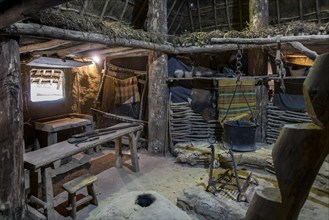 Interior of reconstructed Iron Age house showing furniture and tools at the open-air Archeosite and Museum of Aubechies-Beloeil