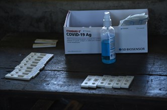 Health worker collects swab sample to test for COVID-19 coronavirus disease during a vaccination drive on the outskirt of Guwahati in India on Monday