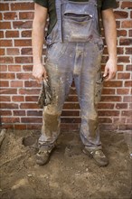 Dirty and tattered dungarees of a construction worker. Berlin