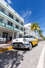 Avalon Hotel Art Deco style architecture and vintage car on Ocean Drive in Miami Beach