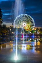 Water Fountain and Ferris Wheel in Dusk in Nice in Provence-Alpes-Cote d'Azur