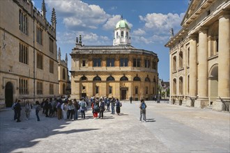 Tourists on the Sheldonian Quad with the Sheldonian Theatre